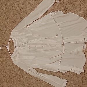Free People sheer white flowy blouse size L. Longer in back, short in front.